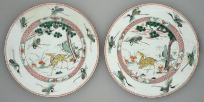 Two Chinese famille verte dishes, Kangxi period, painted with a yellow deer, phoenix and sacred
