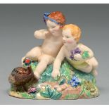 J S Bray and V Williams. A Dulwich Pottery group of two children and a pheasant, 1934, 75mm h,