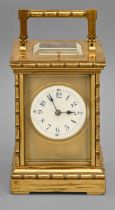 A French brass carriage clock, c1900, the enamel dial with blue chapters and blued steel hands,