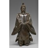A Japanese bronze sculpture of  the Emperor Meiji dressed in Shinto style holding a ceremonial stuff