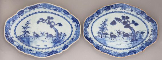 A pair of Chinese blue and white dishes, 18th / early 19th c, painted with an island scene with