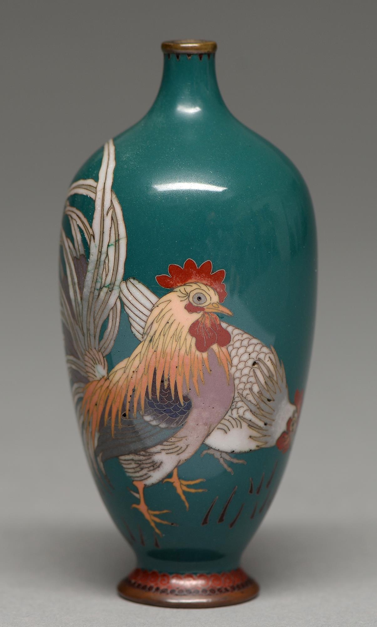 A Japanese cloisonne enamel vase, Meiji period, enamelled with a cock and hen on a green ground,
