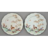 A pair of Chinese famille rose plates, 18th c, enamelled with deer, bamboo and sacred fungus, 23cm
