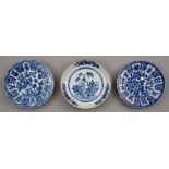 Two Chinese blue and white plates, 18th c, painted with trees growing from hollow rocks, the