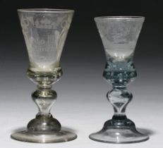 Two Bohemian glass goblets, late 18th c, soda metal, the thistle shaped bowl engraved with stag