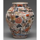 An Imari jar, Edo period, 18th c, octagonal, freely painted in underglaze blue and overglaze red and