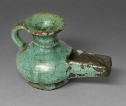 A Persian turquoise glazed pottery oil lamp, Safavid dynasty, 68mm h   Provenance: Cotterill