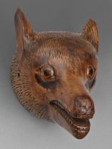 Folk art. A Victorian carved wood head of a fox, with glass eyes, 15cm h Ears slightly damaged, nose