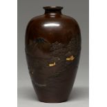 A Japanese bronze vase, Meiji period, carved and inlaid in gold and shibuichi with a landscape, 16.