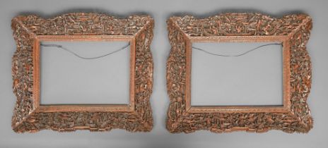A pair of Chinese pierced, carved and stained wood frames, late 19th / early 20th c, with