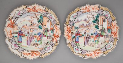 A pair of Chinese famille rose plates, c1780, richly enamelled with 'mandarin' scenes, the purple