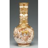 A Satsuma ware vase, Meiji period, the cylindrical neck with moulded lappets, richly enamelled and