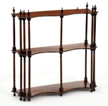 A set of George III mahogany hanging shelves, the three figured serpentine shelves with six