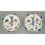 Two Chinese wucai dishes, Kangxi period, painted with sacrificial vessels and auspicious emblems