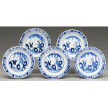 A set of five Chinese blue and white miniature plates, 19th c, painted with a woman and child