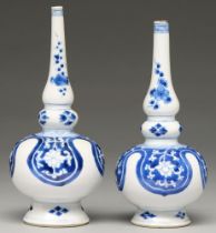 Two Chinese blue and white rosewater sprinklers, 18th c, painted with flower filled lappets