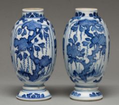 A pair of Chinese blue and white vases, 18th c or later, ovoid, painted with cross hatched trees