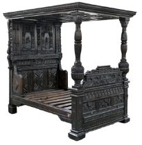 An oak four poster bed, mid 17th c,  the diamond panelled tester with carved cushion moulded