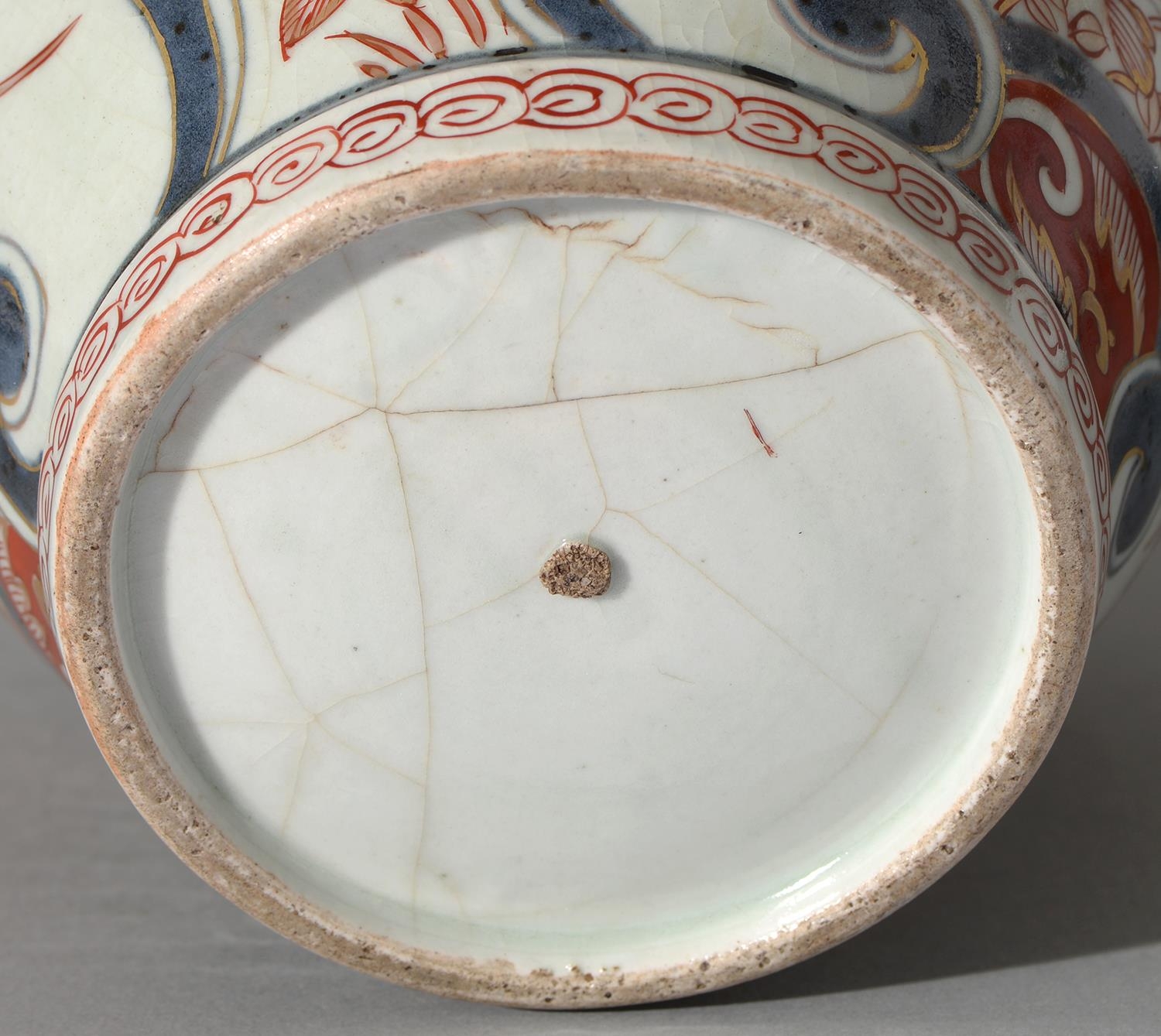An Imari jar, Edo period, 18th c, painted in underglaze blue with fan shaped panels of - Image 2 of 2
