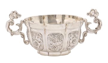 A George V silver porringer, in William and Mary style and of unusually heavy gauge, cast caryatid