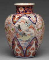 An Imari vase, 19th / 20th c, enamelled with cranes and other birds between lappet borders, 41cm h