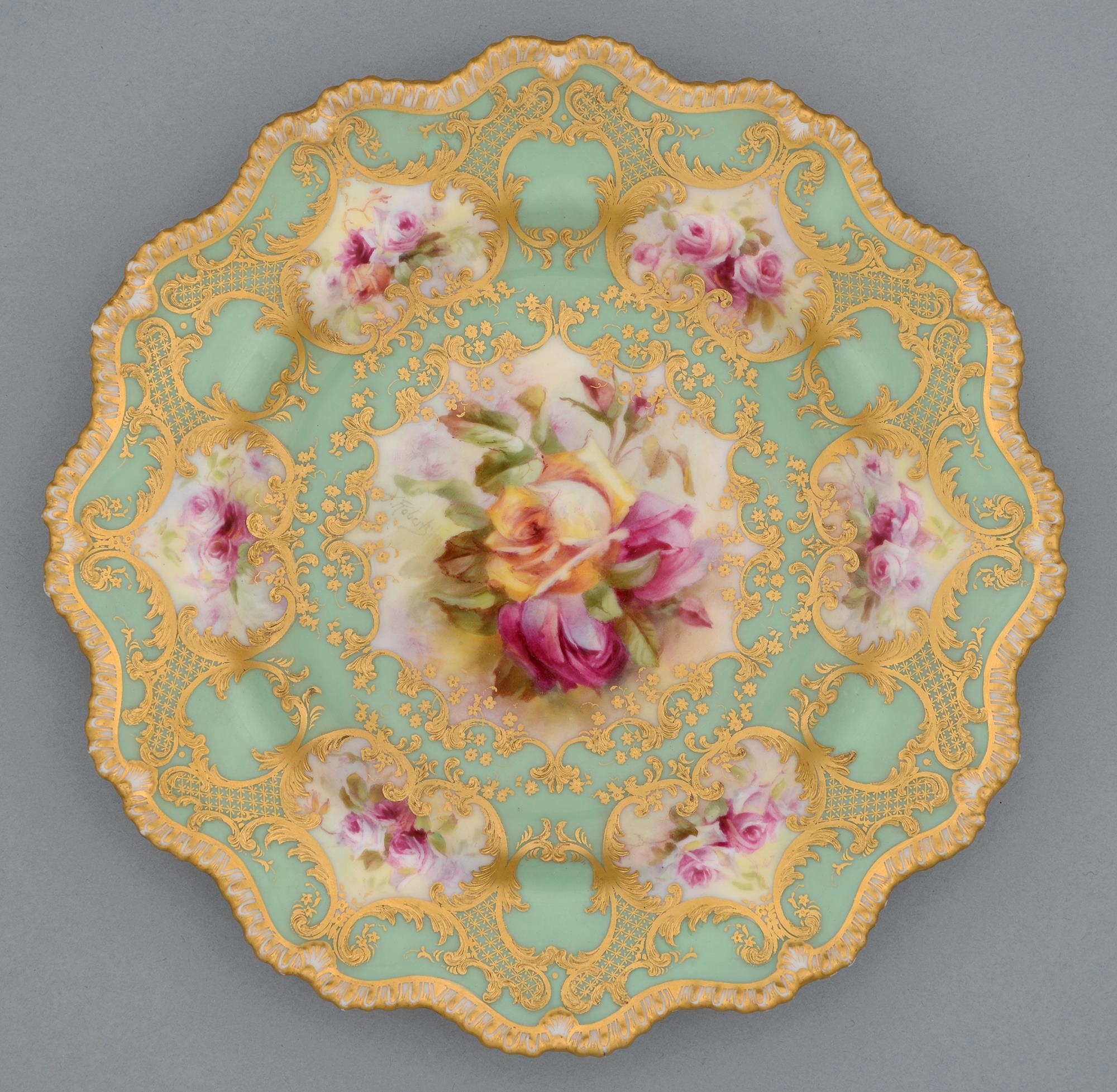 A Royal Worcester plate, c1917, painted by Roberts, signed, with two or three pink and yellow