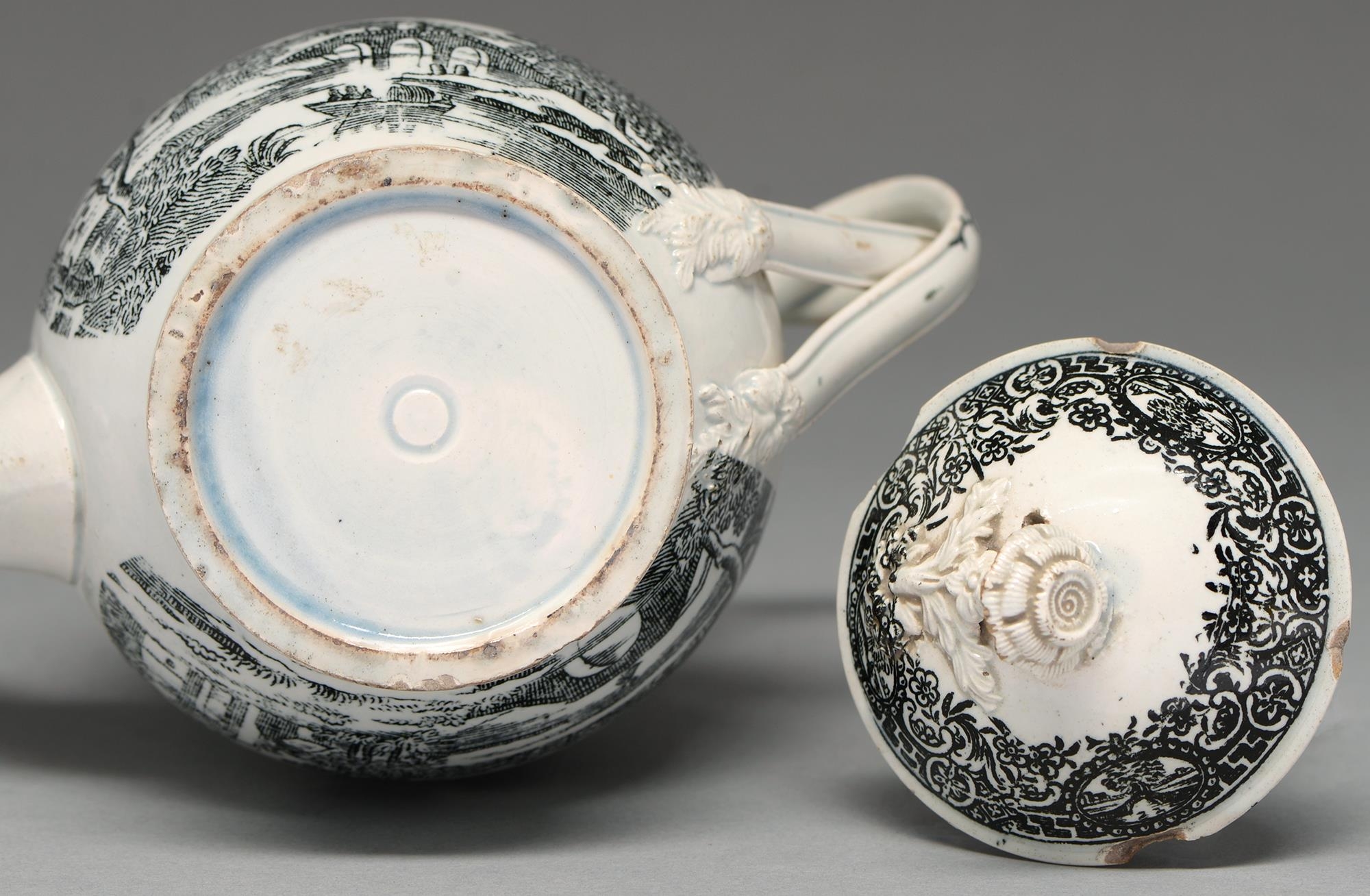 A pearlware teapot and cover, probably Yorkshire, c1800, ovoid with entwined handle and two black - Image 2 of 2
