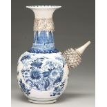 A Chinese blue and white kendi, 19th c, with later silver mounts, painted with flowers in barbed