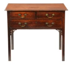 A George III oak lowboy, with three cockbeaded drawers and pierced brackets, 71cm h; 48 x 83cm Two