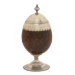 A Victorian EPNS mounted French coconut cup and cover, incised with strapwork, on beaded foot, 19.