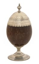 A Victorian EPNS mounted French coconut cup and cover, incised with strapwork, on beaded foot, 19.