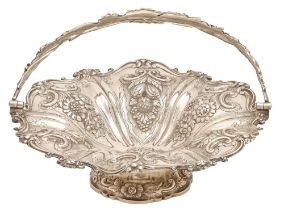 A Victorian silver basket, chased in high relief with fruit and flowers, swing handle, on conforming