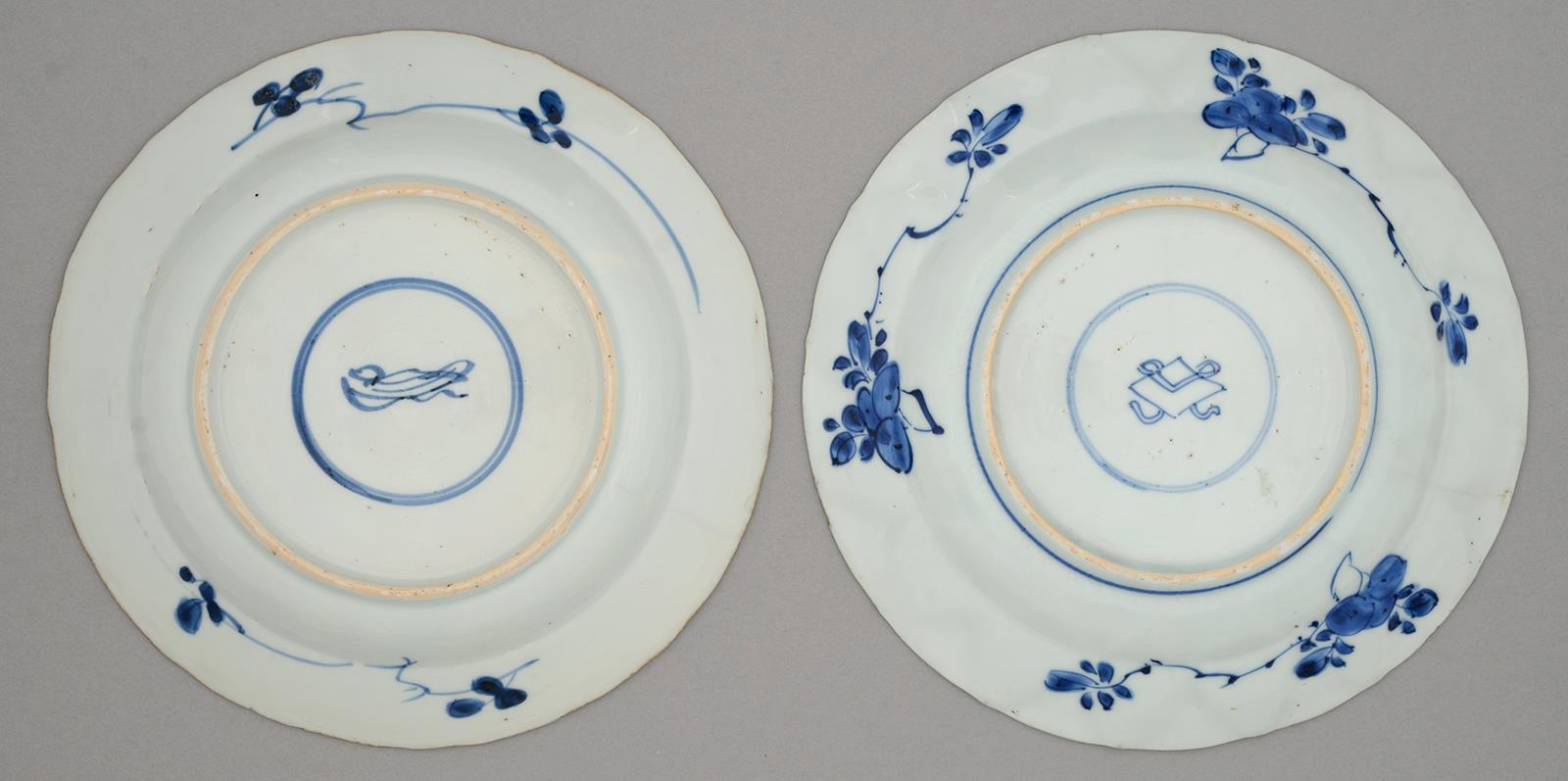 Two Chinese blue and white plates, Kangxi period, painted with a flower filled basket or formal - Image 2 of 2
