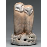 A Royal Copenhagen porcelain group of two barn owls, c1938, on pierced perch of gnarled branches,