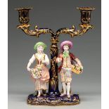 A Minton candelabrum, c1830, of two richly gilt cobalt sconces on scrolling branches and a palm