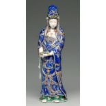 A Japanese porcelain figure of Kannon, early 20th c, with turquoise lined blue robe with gilt