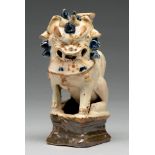 A Chinese cream, cobalt and manganese glazed tileworks dog of Fo incense burner, 18th c, 16cm h