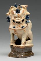 A Chinese cream, cobalt and manganese glazed tileworks dog of Fo incense burner, 18th c, 16cm h