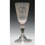 A German goblet,  18th c, the faceted, rounded funnel bowl engraved with two circular framed