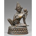 A South East Asian silvered brass sculpture of Avalokita Chittravishrama, on double lotus base,