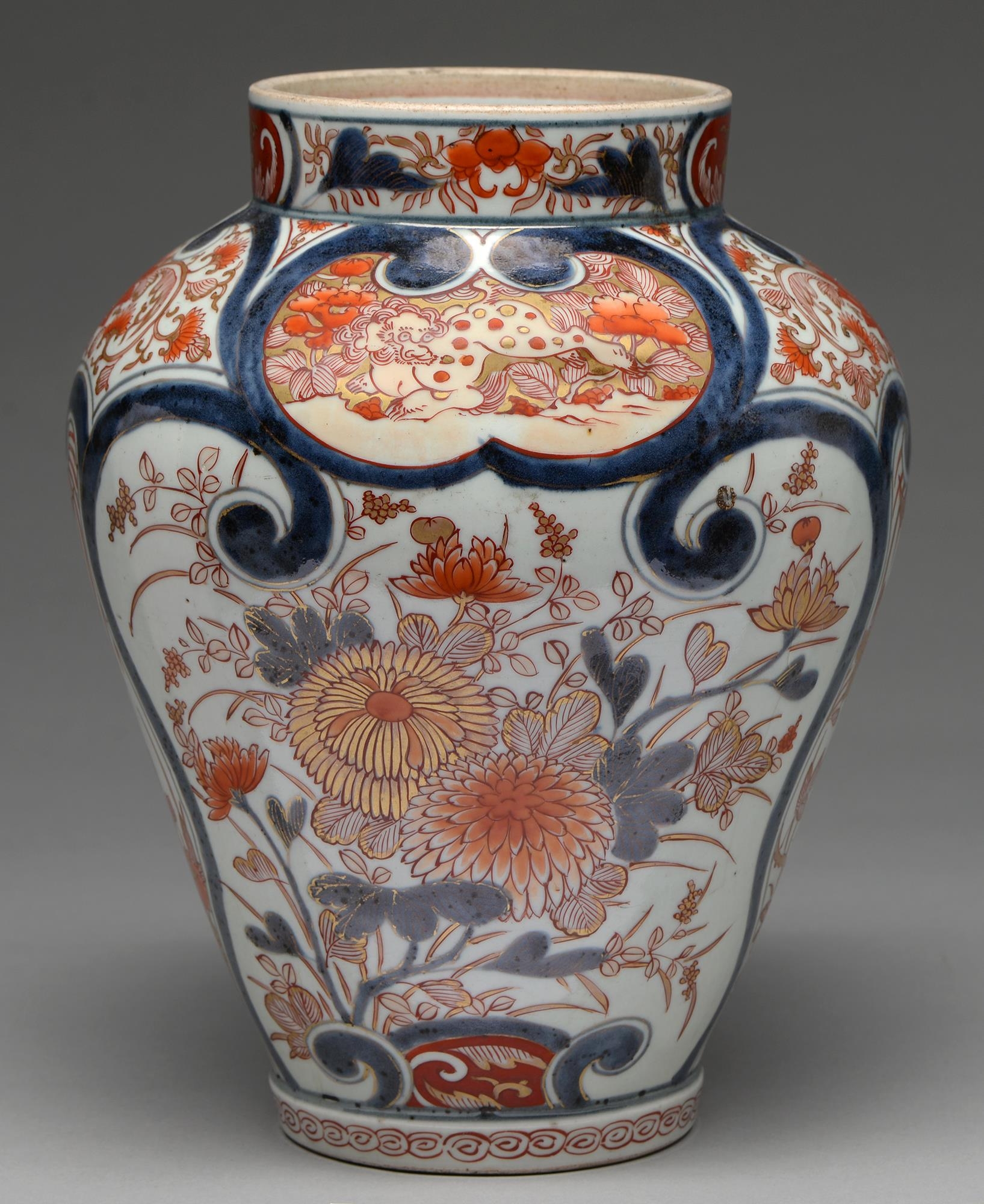 An Imari jar, Edo period, 18th c, painted in underglaze blue with fan shaped panels of