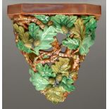 A William Brownfield majolica wall bracket, c1877, the shelf supported by entwined open oak boughs