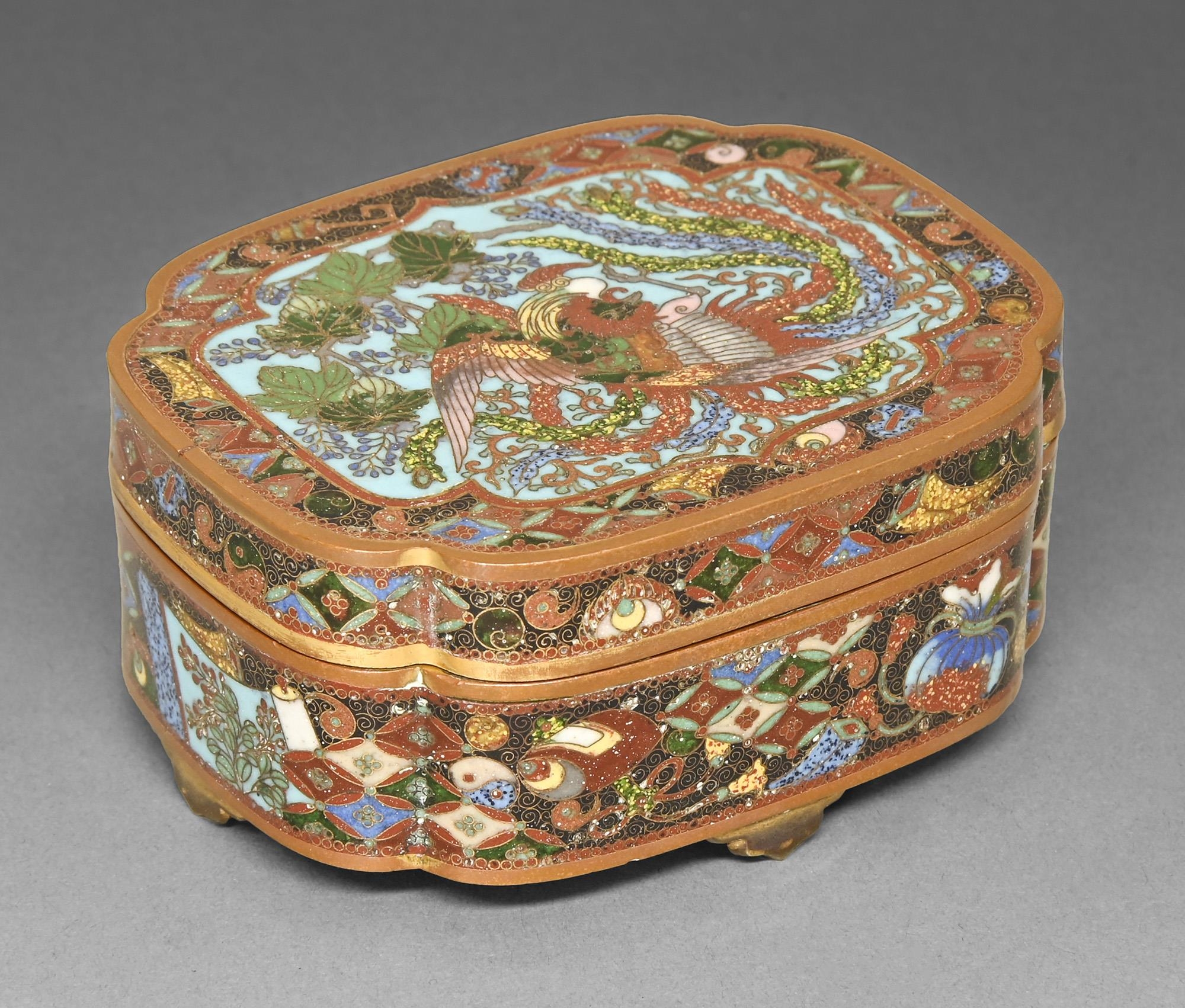 A Japanese cloisonne enamel box and cover, Meiji period, the cover enamelled with phoenix on a
