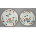 A graduated pair of Chinese famille rose dishes, 18th c, painted with peonies, willow and