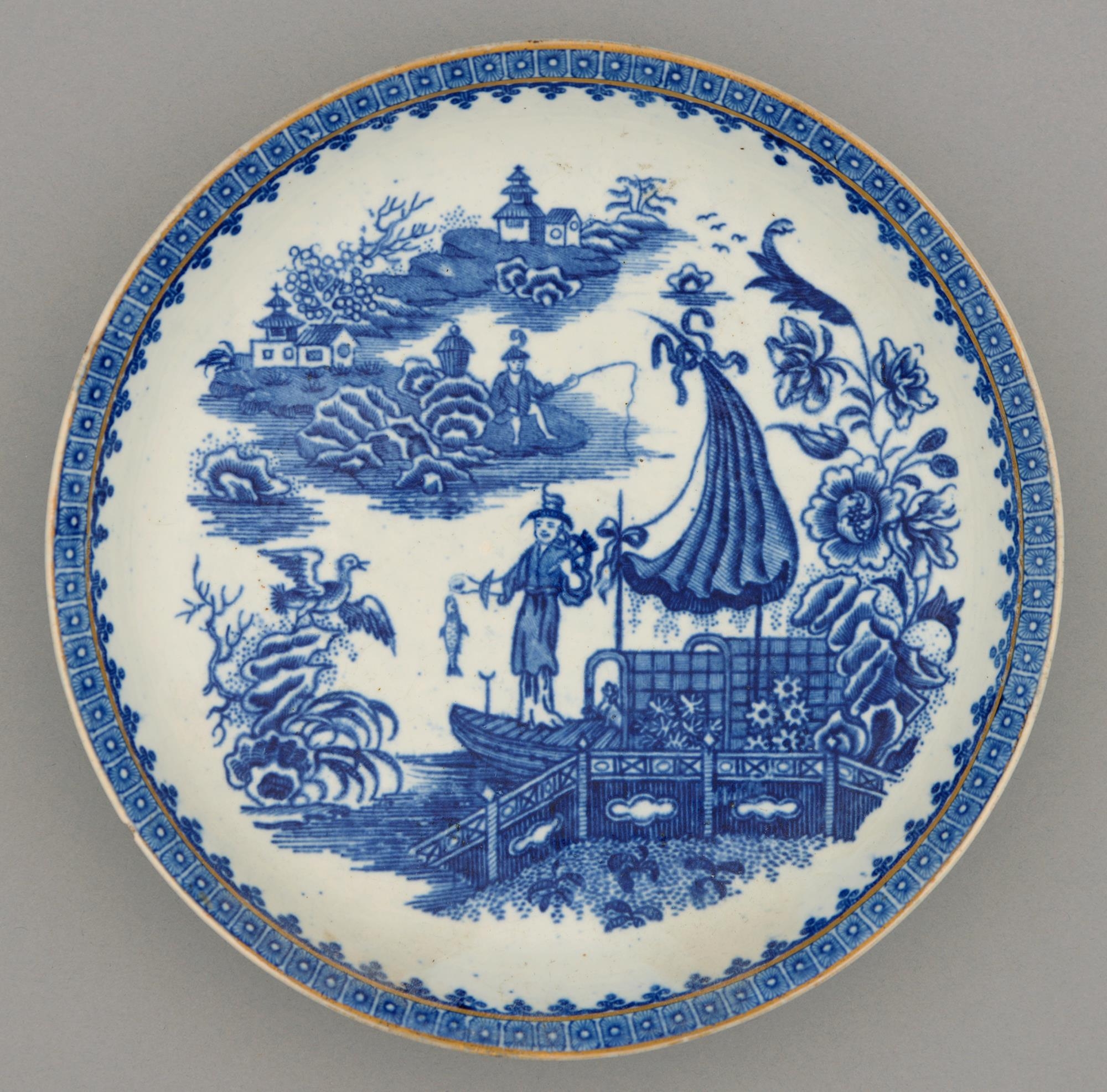 A Worcester blue and white saucer dish, c1790, transfer printed with the Fisherman pattern, 20.5cm