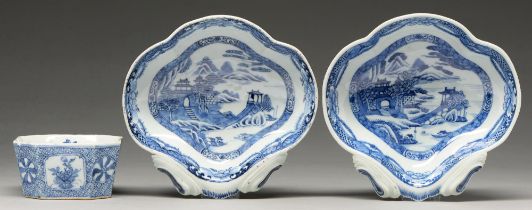 Two Chinese blue and white shell shaped dessert dishes, early 19th c, painted with riverside