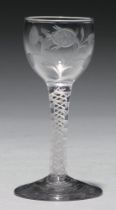 A wine glass, c1770, the cup bowl engraved with Jacobite rose and bud and bird, on double series