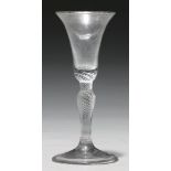 A wine glass, mid 18th c, the bell bowl with solid base on inverted baluster multi spiral air