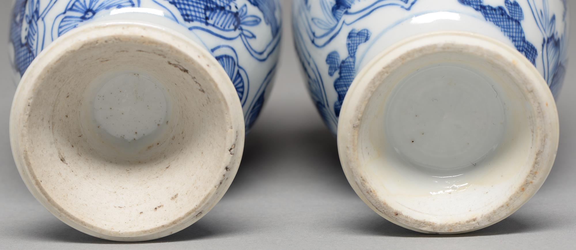 A pair of Chinese blue and white vases, 18th c or later, ovoid, painted with cross hatched trees - Image 2 of 2