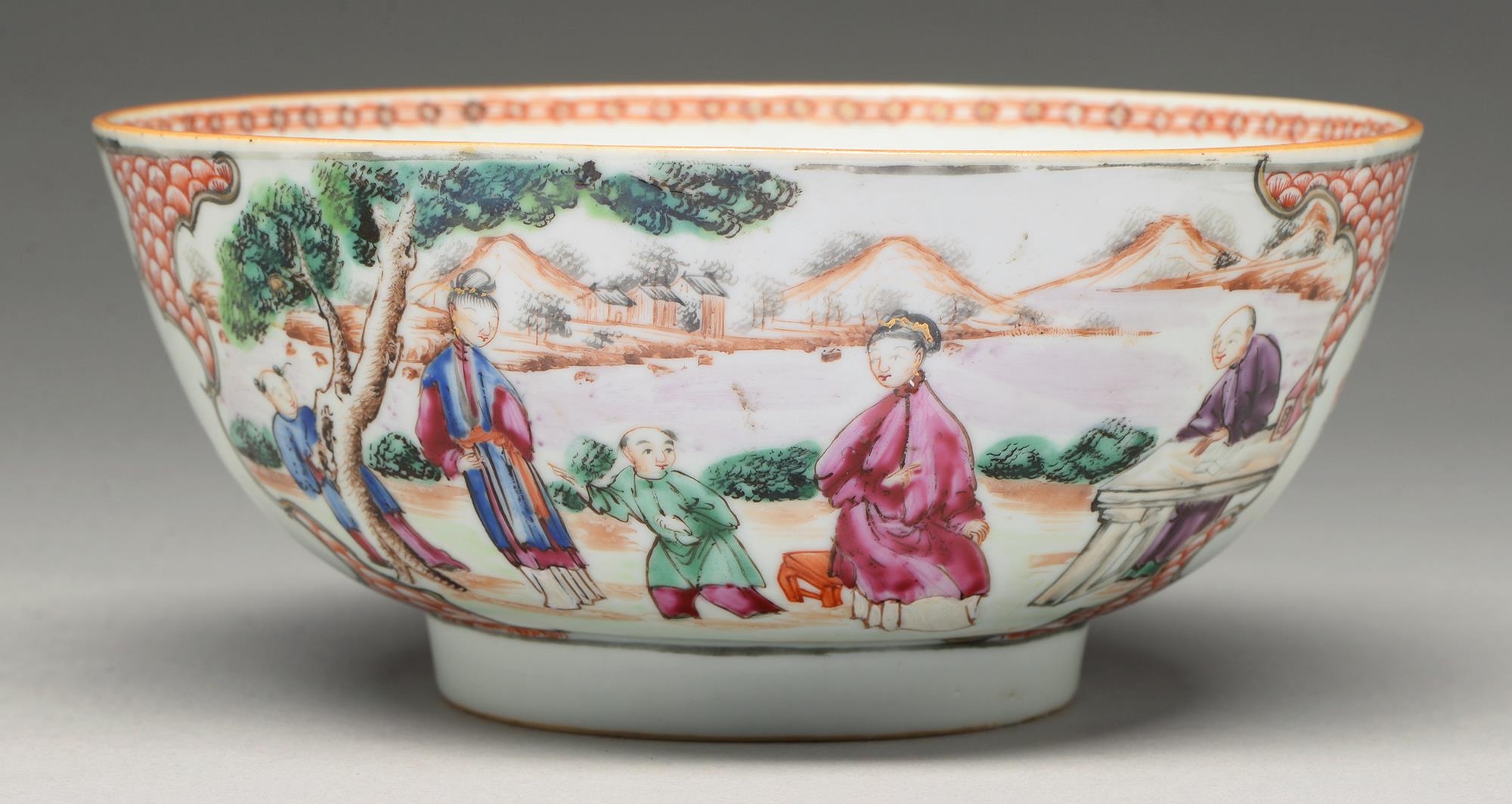 A Chinese famille rose bowl, c1770, painted with two groups of figures by water in a mountainous - Image 2 of 3